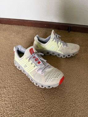 On Cloud Running Shoes in Light Gray with Pale Yellow and Coral Accents
